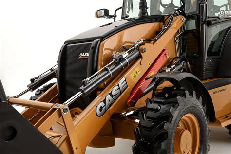 The Case 580ST backhoe loader in action, demonstrating its digging capabilities.