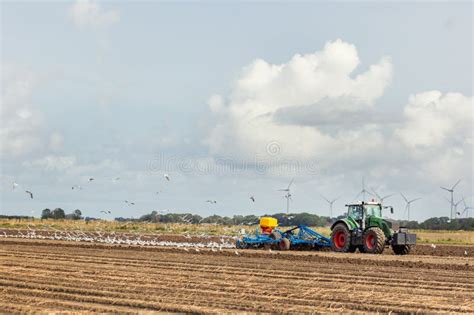 Thematic photo of an agricultural field and a modern aggregate sowing machine