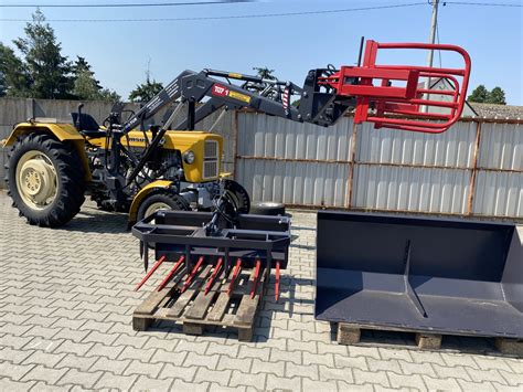 schemat działania mechanizmu samopoziomującego w ładowaczu czołowym